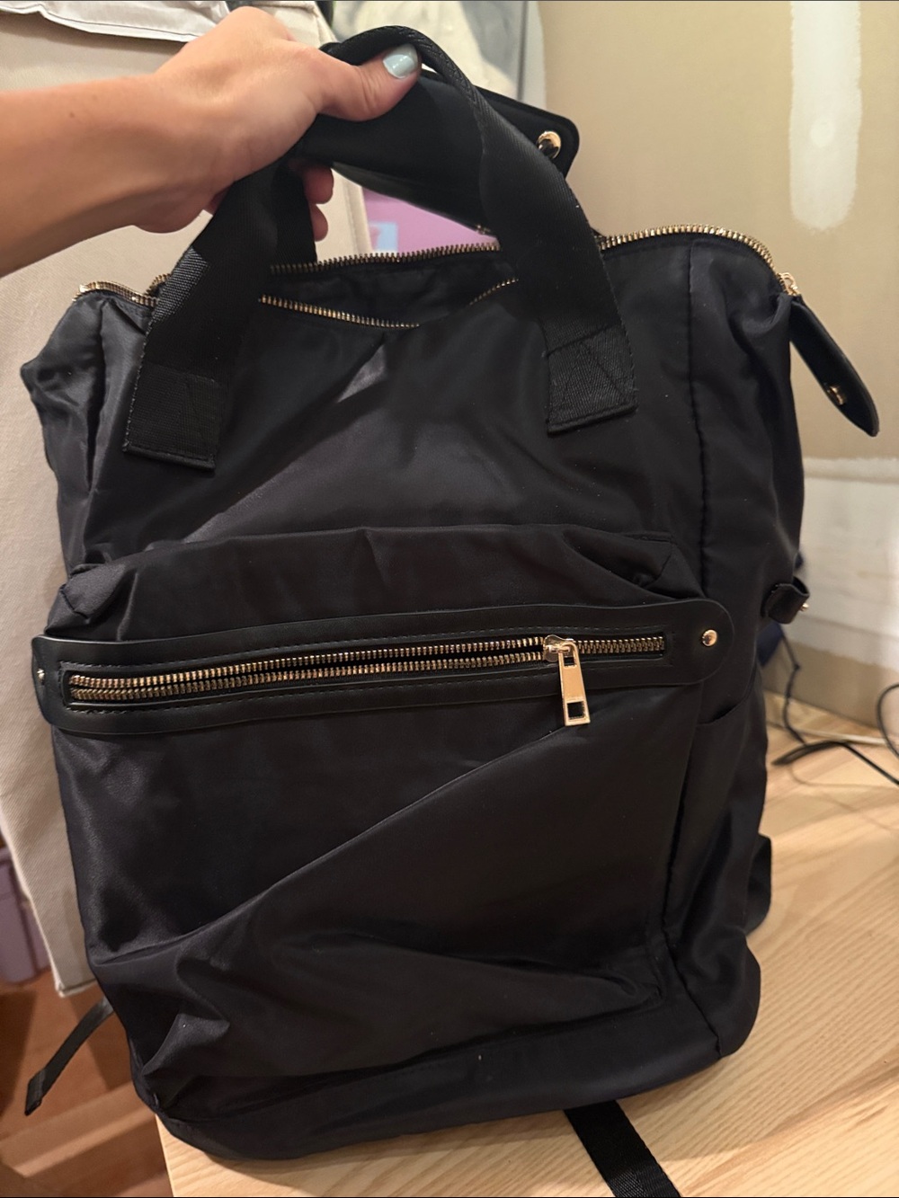 A new a day polyester Backpack with Gold Zippers